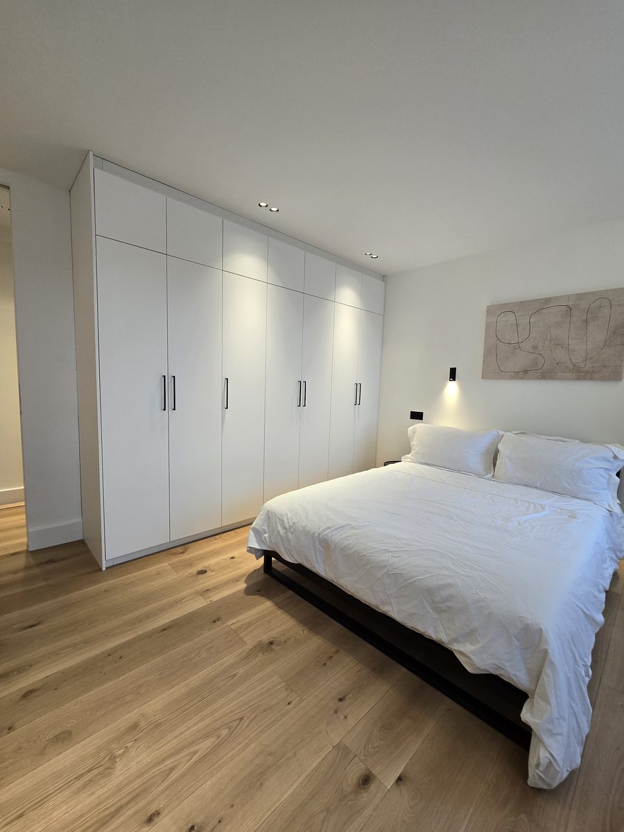 Marylebone bedroom with skylight and built-in wardrobe